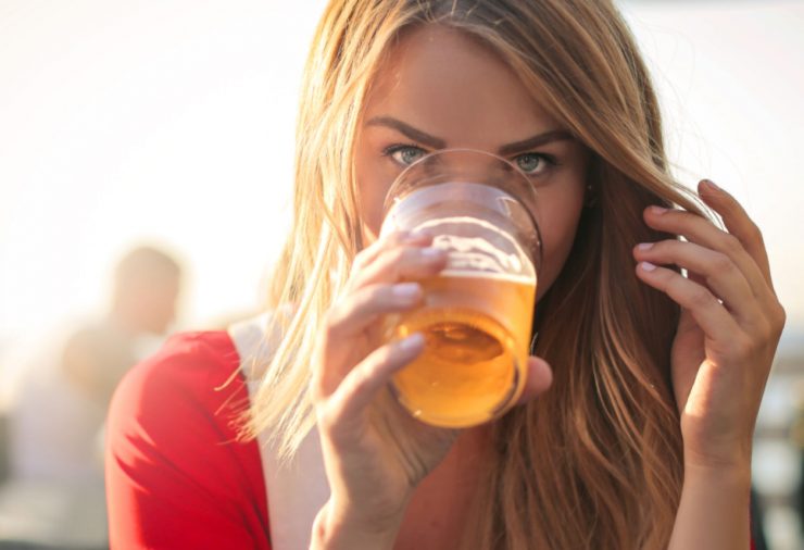 Woman Drinking Beer Outside
