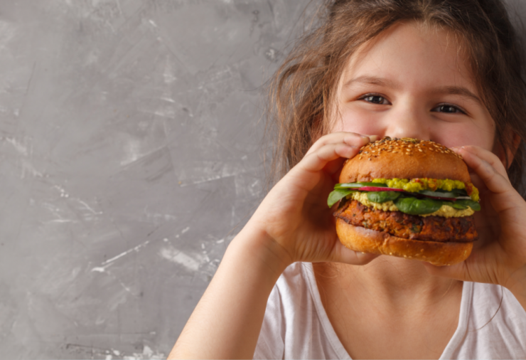 Girl Eating Veggie Burger